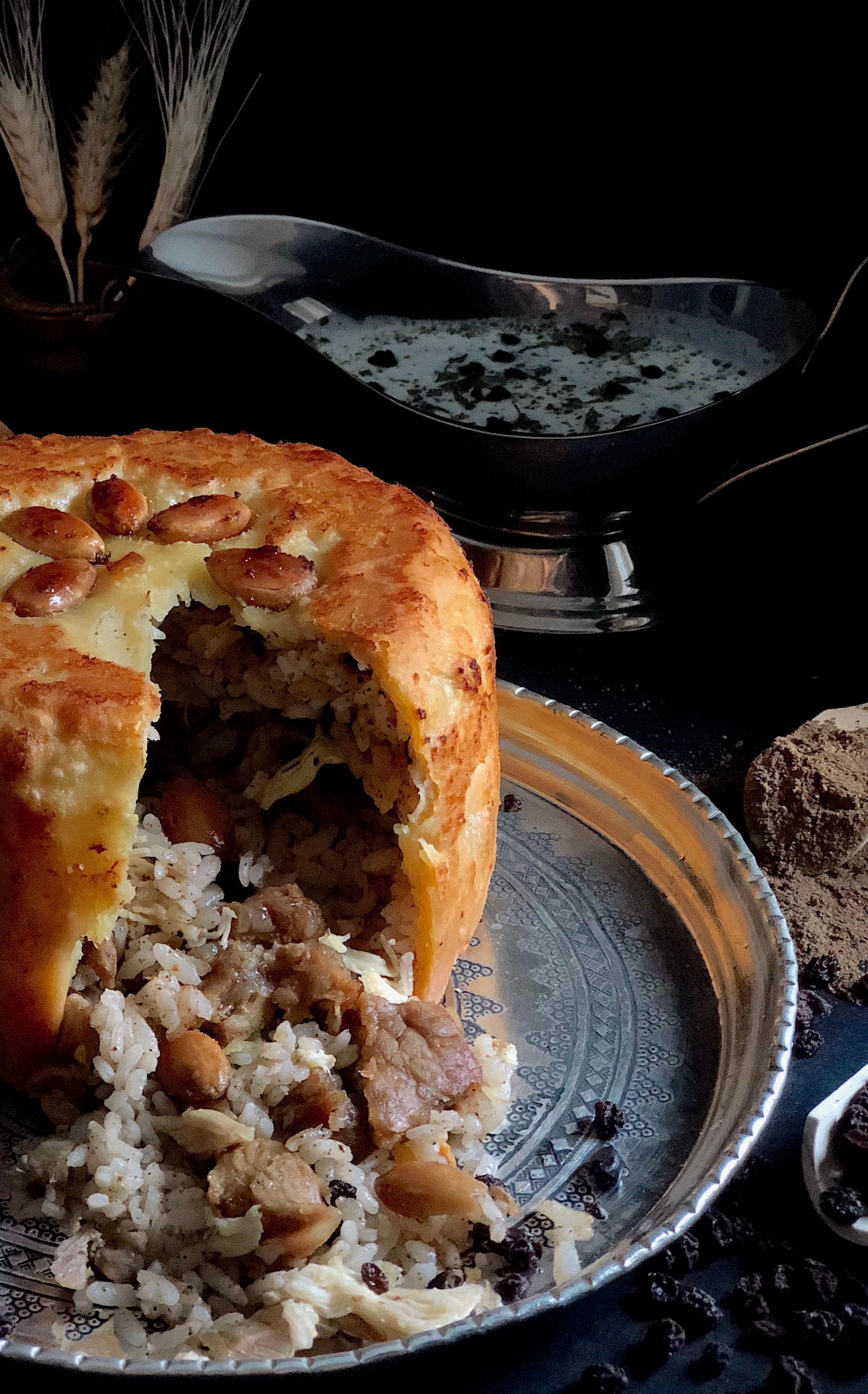 A delicious traditional pilaf wrapped in a golden pastry with almonds, perfect for festive meals.