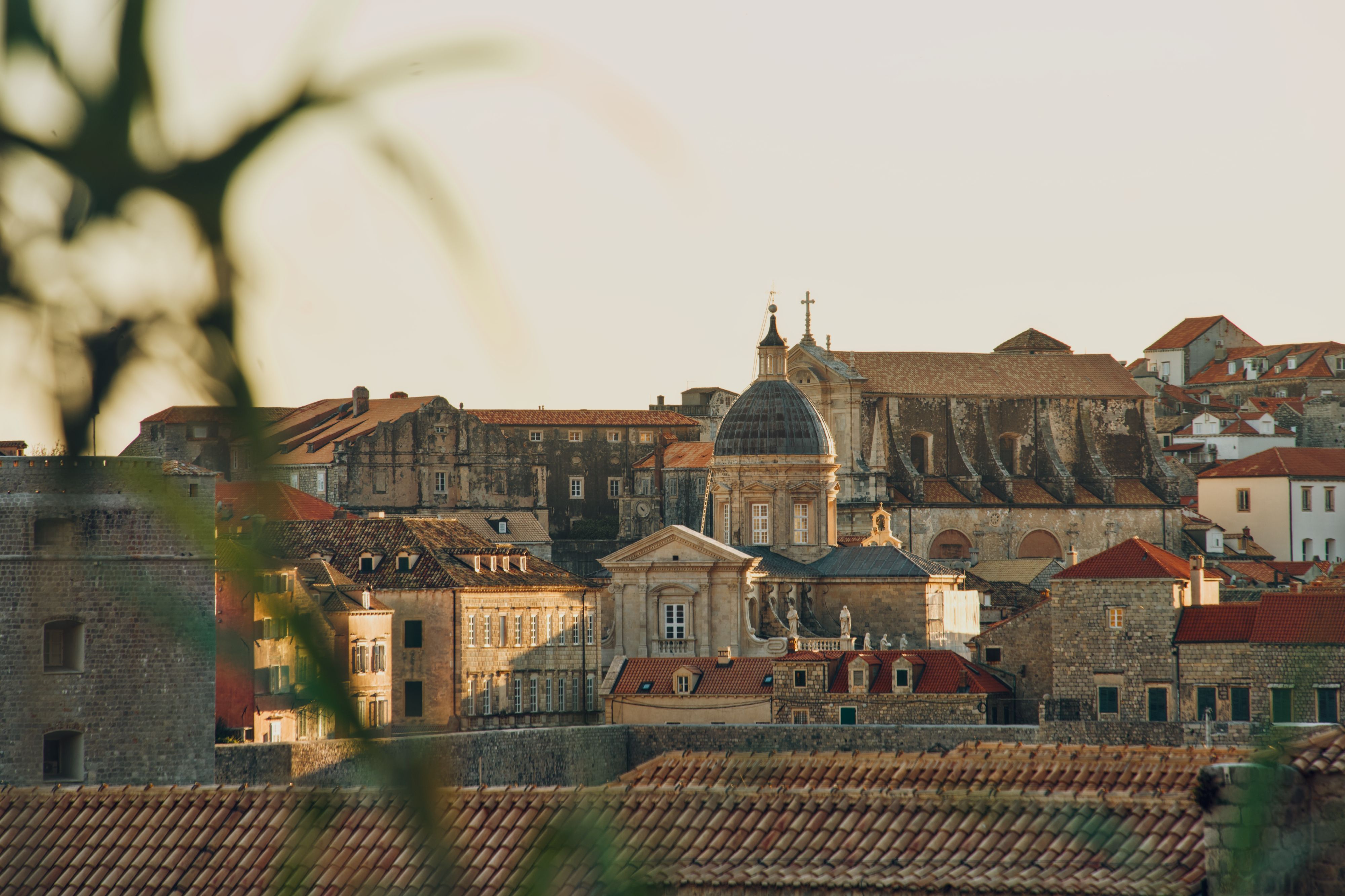 Stradun in Dubrovnik Old Town at dusk with limestone paving lit warm gold