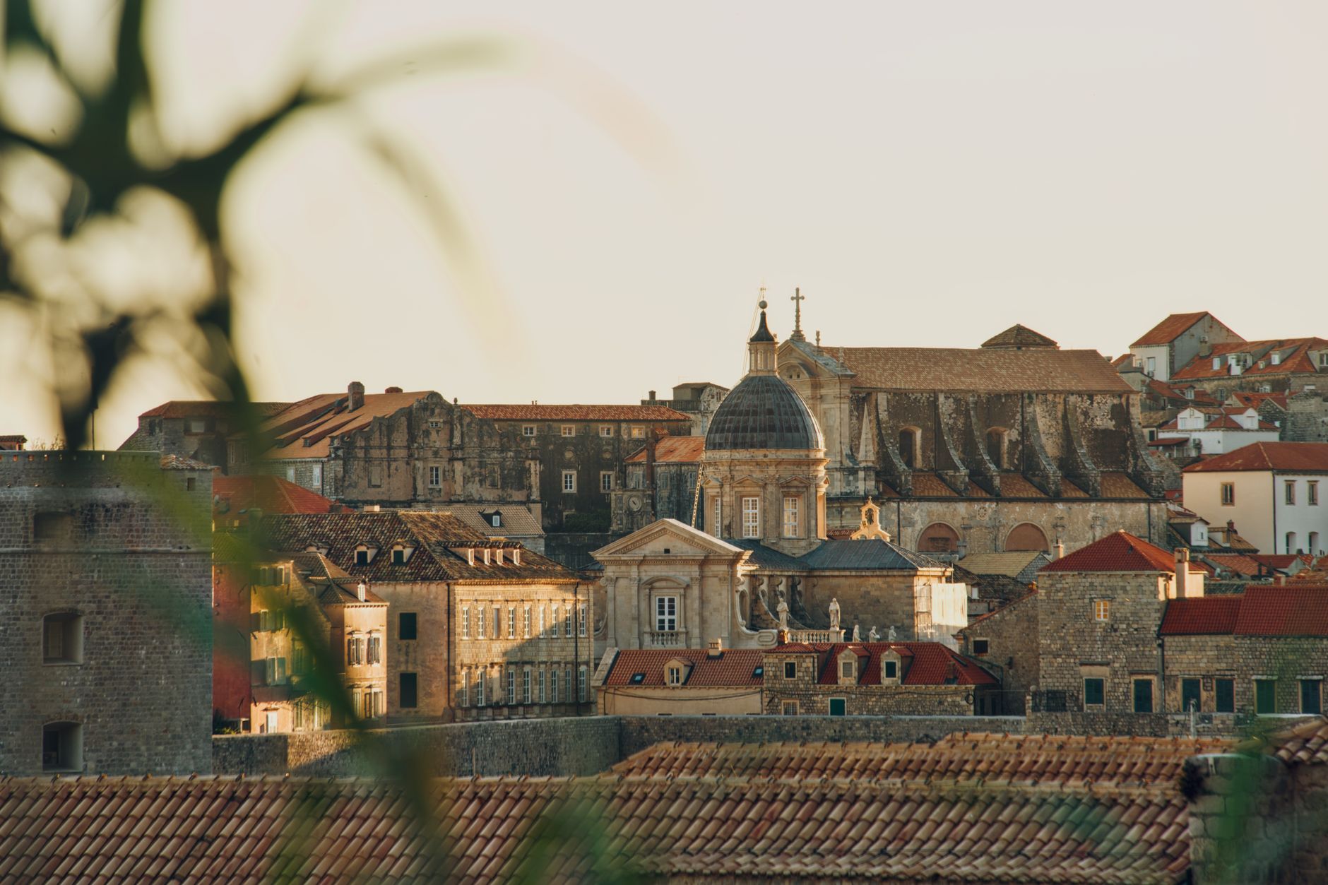 Stradun in Dubrovnik Old Town at dusk with limestone paving lit warm gold