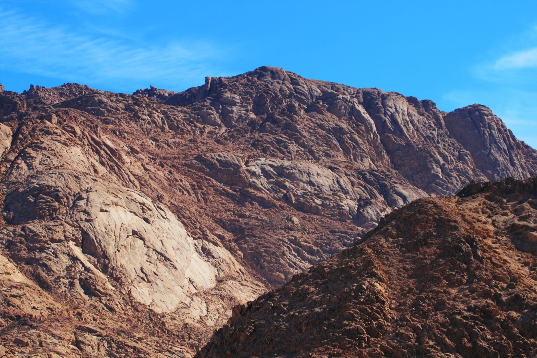 Majestic rocky mountain scene with clear blue sky, perfect for nature lovers and adventurers.