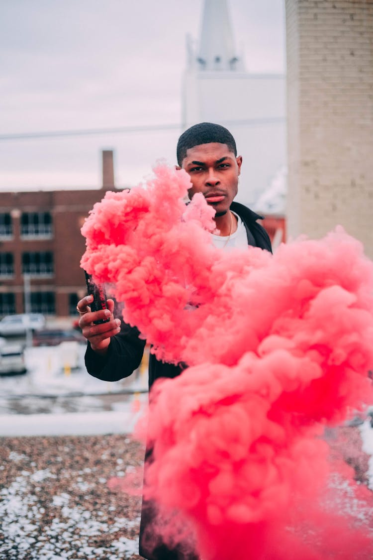 Black Man With Activated Flare With Pink Fume