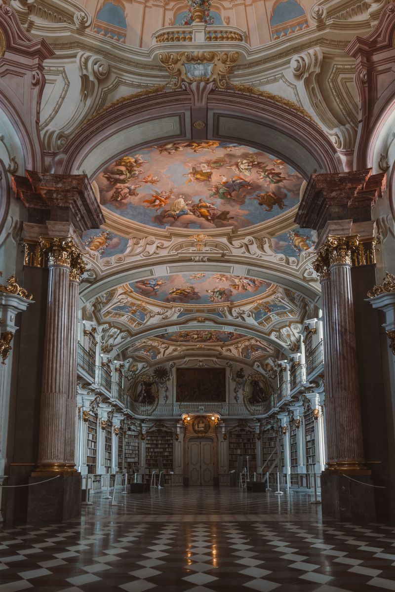 Capture of a stunning Baroque-style ceiling in an Austrian monastery library, showcasing grand architecture.