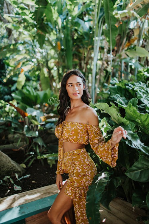 Attractive Woman Near Green Plants