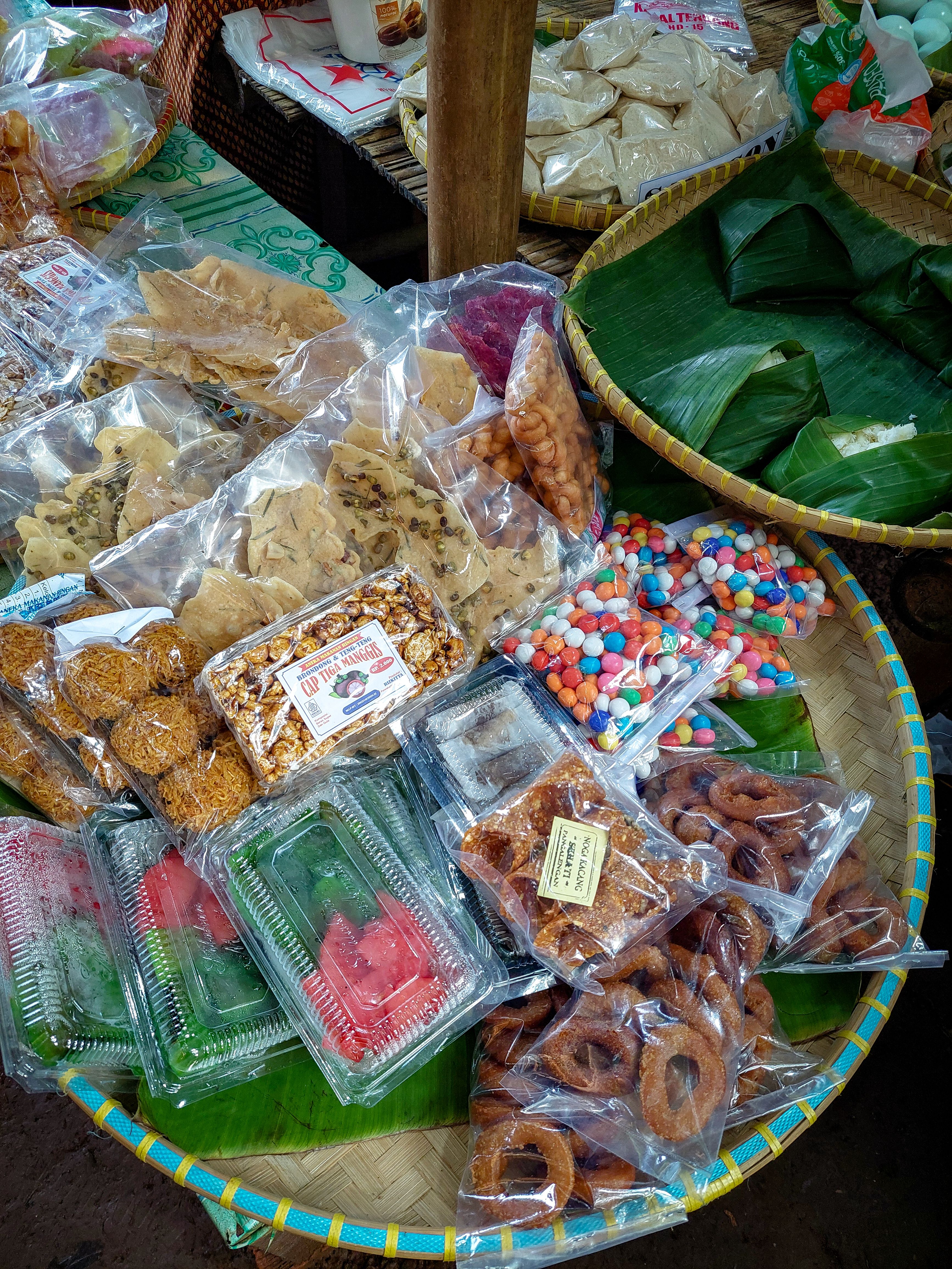 Assorted Traditional Asian Snacks Display at Market · Free Stock Photo