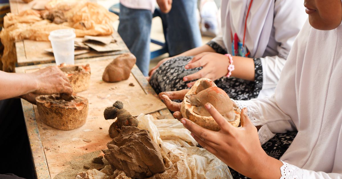 Students working on a group project with local cultural artifacts