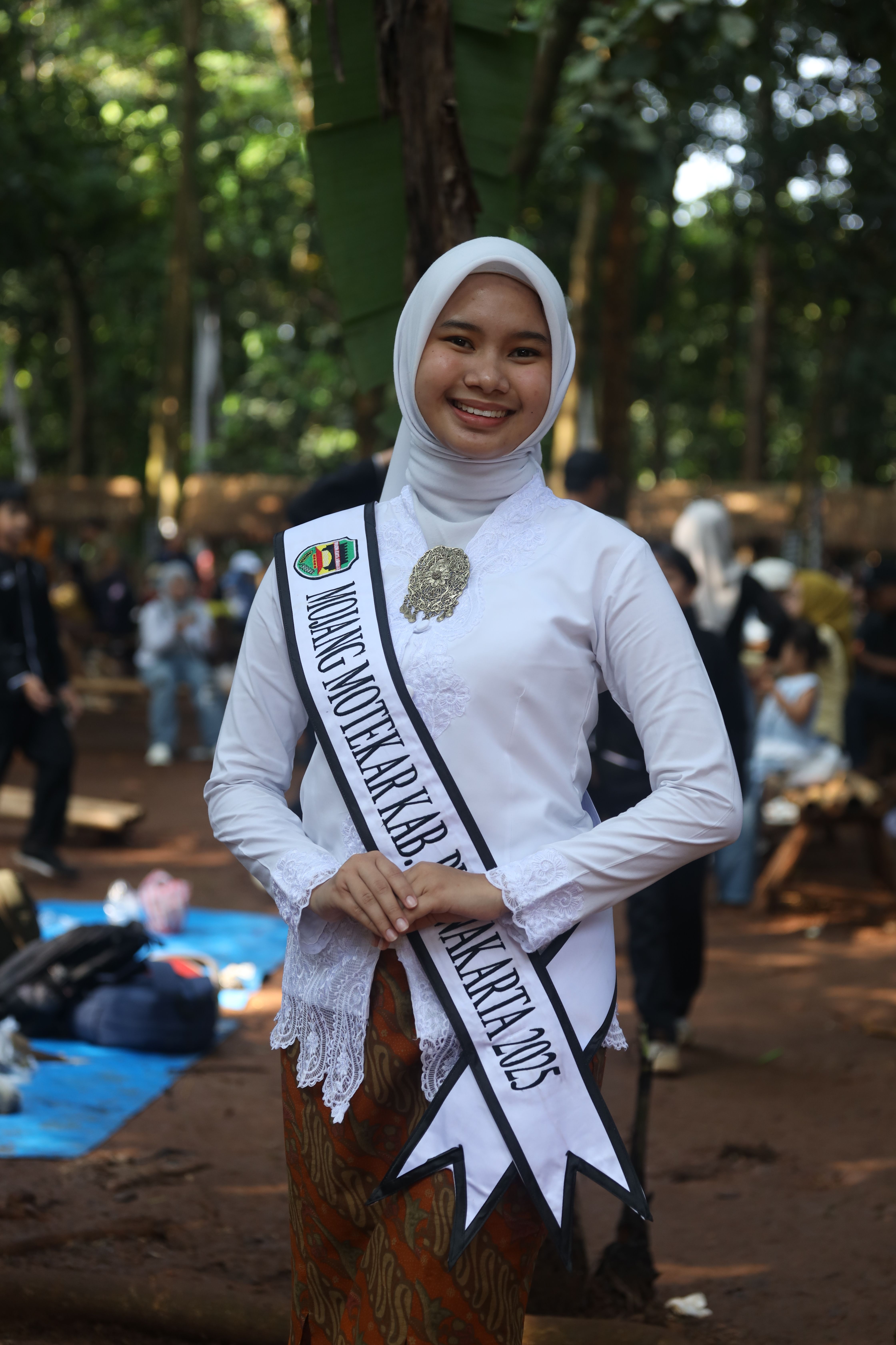 Young Woman in Cultural Attire at Outdoor Event