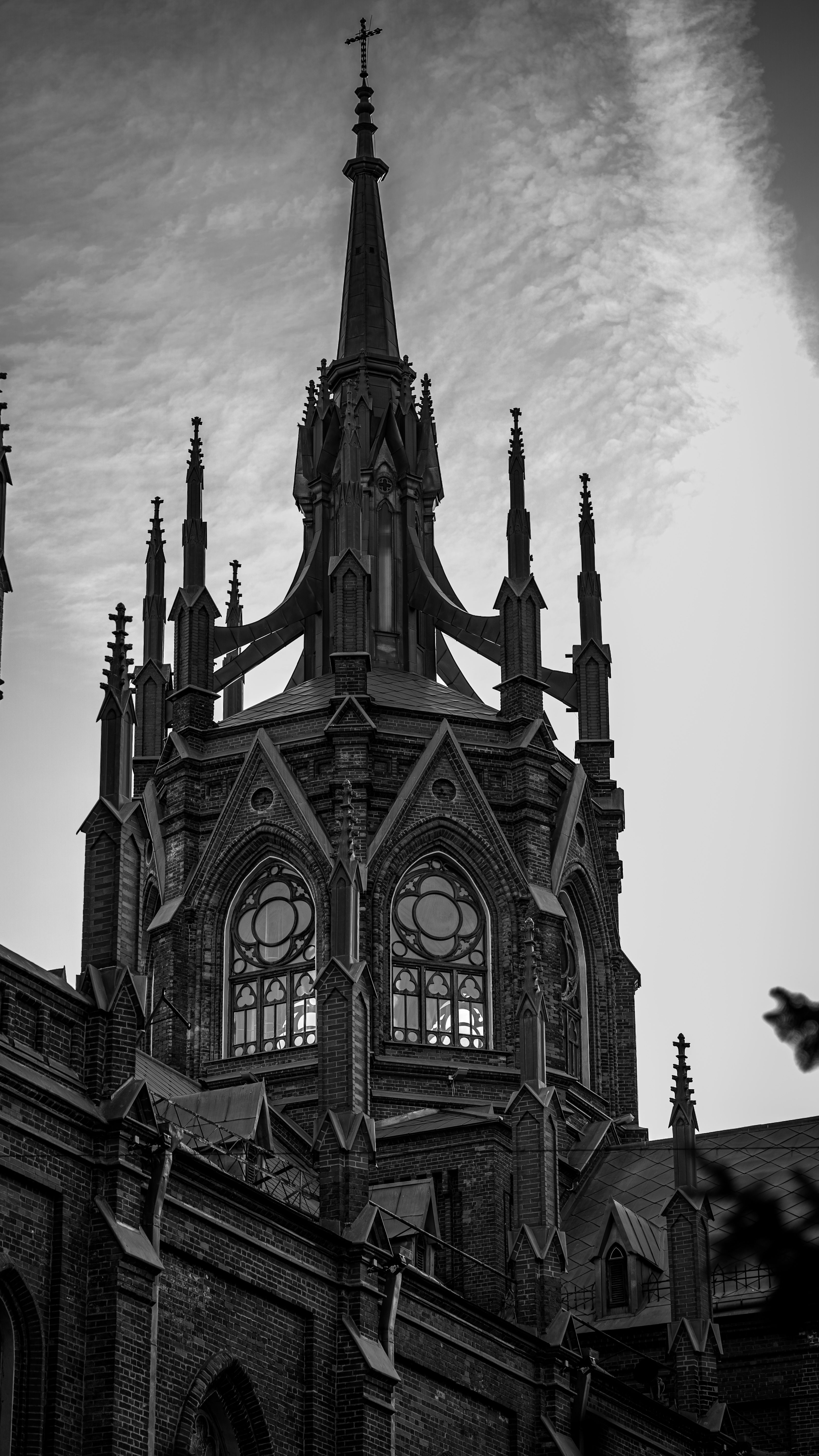 Gothic Cathedral Spire Against Dramatic Sky · Free Stock Photo
