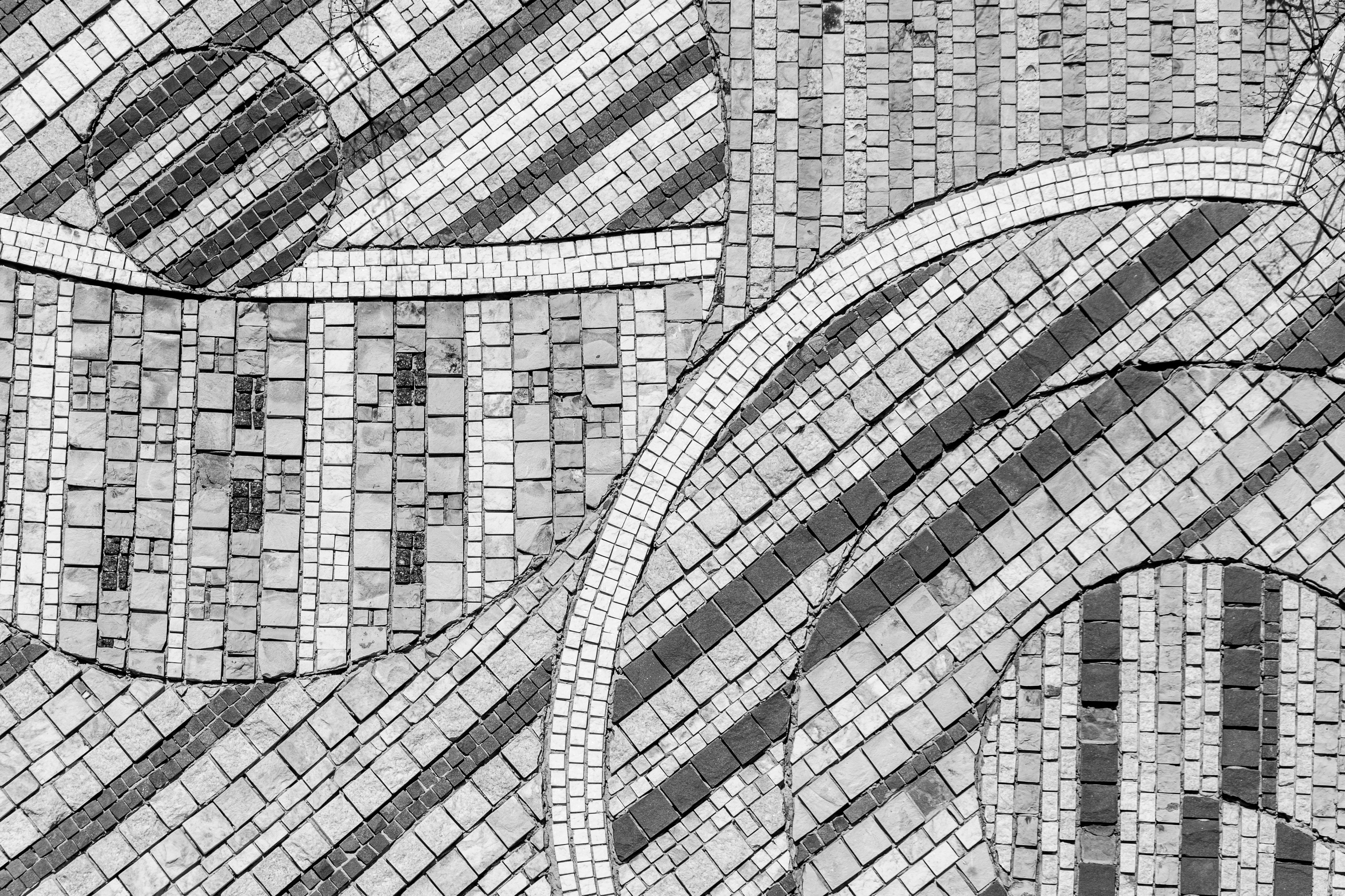 Abstract black and white mosaic floor pattern with geometric shapes and lines.. abstract, black, white