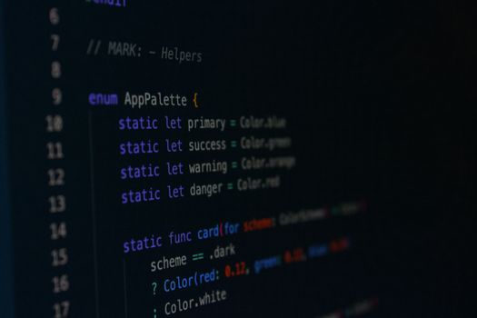 Macro photography of color palette code in a programming environment.