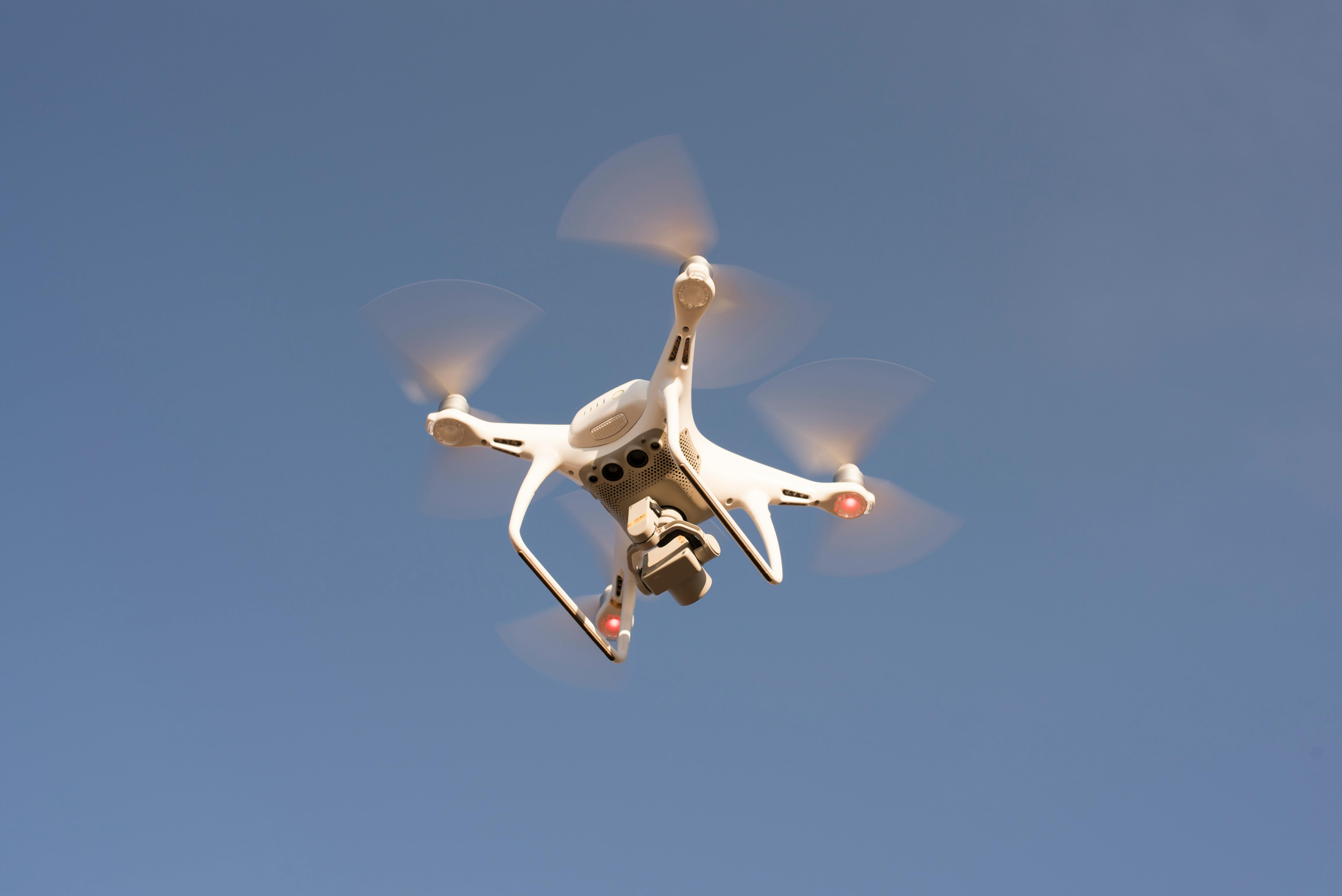 low angle shot of drone flying in the sky