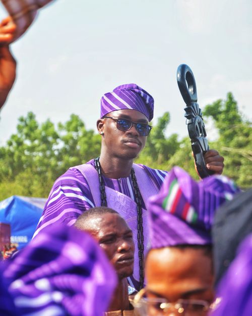 Free A man in colorful traditional clothing participates in an outdoor African ceremony. Stock Photo
