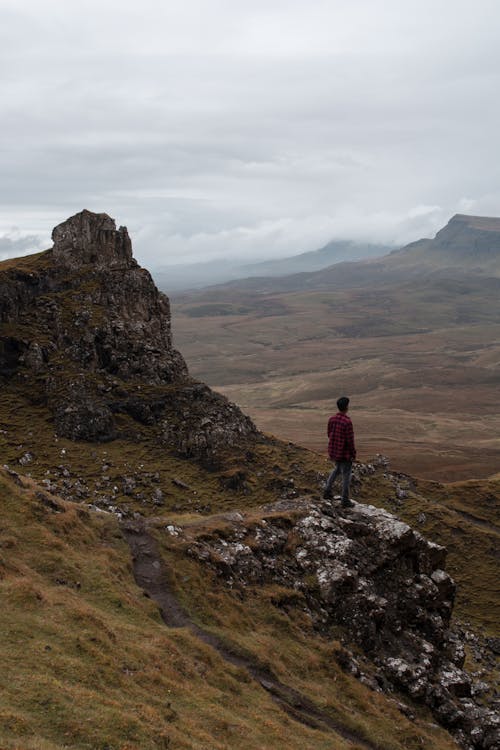 Man  Standing on Rock Mountain