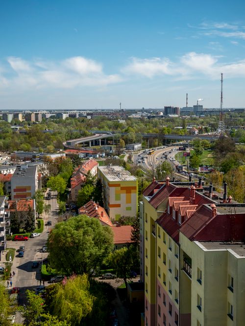 Free Scenic aerial view of vibrant Wrocław cityscape, capturing colorful buildings and lush greenery in spring. Stock Photo