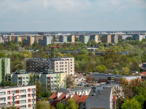 Free Panoramic aerial view of Wrocław's residential area with lush greenery in spring. Stock Photo