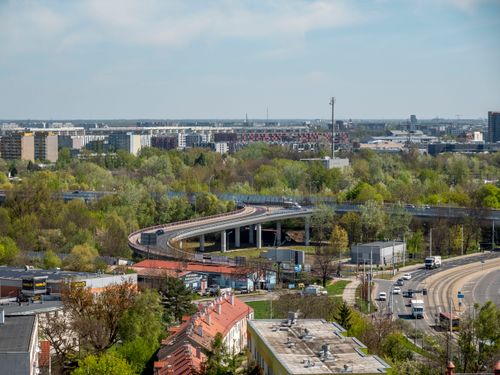 Free A scenic aerial view of Wrocław with winding roads and lush greenery in Poland. Stock Photo