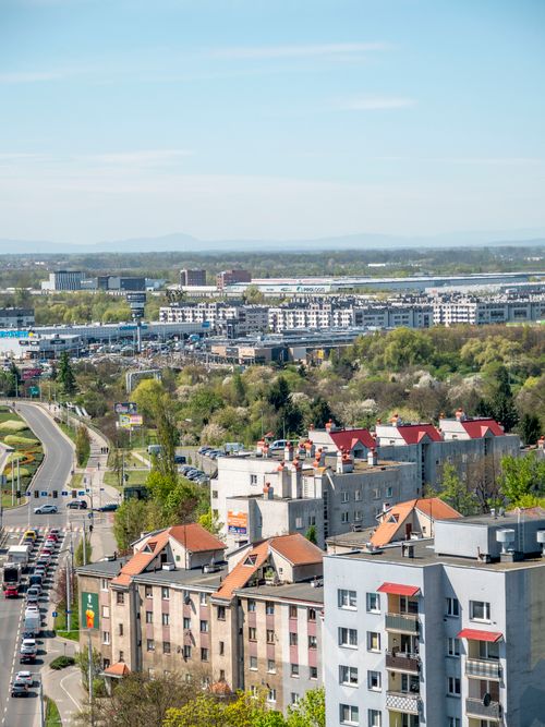 Free Aerial view showcasing Wrocław's urban landscape with residential buildings and greenery. Stock Photo