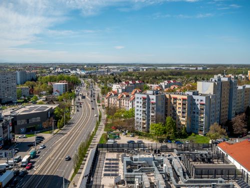 Free Urban cityscape of Wrocław, Poland, showcasing residential buildings and roads under a bright sky. Stock Photo