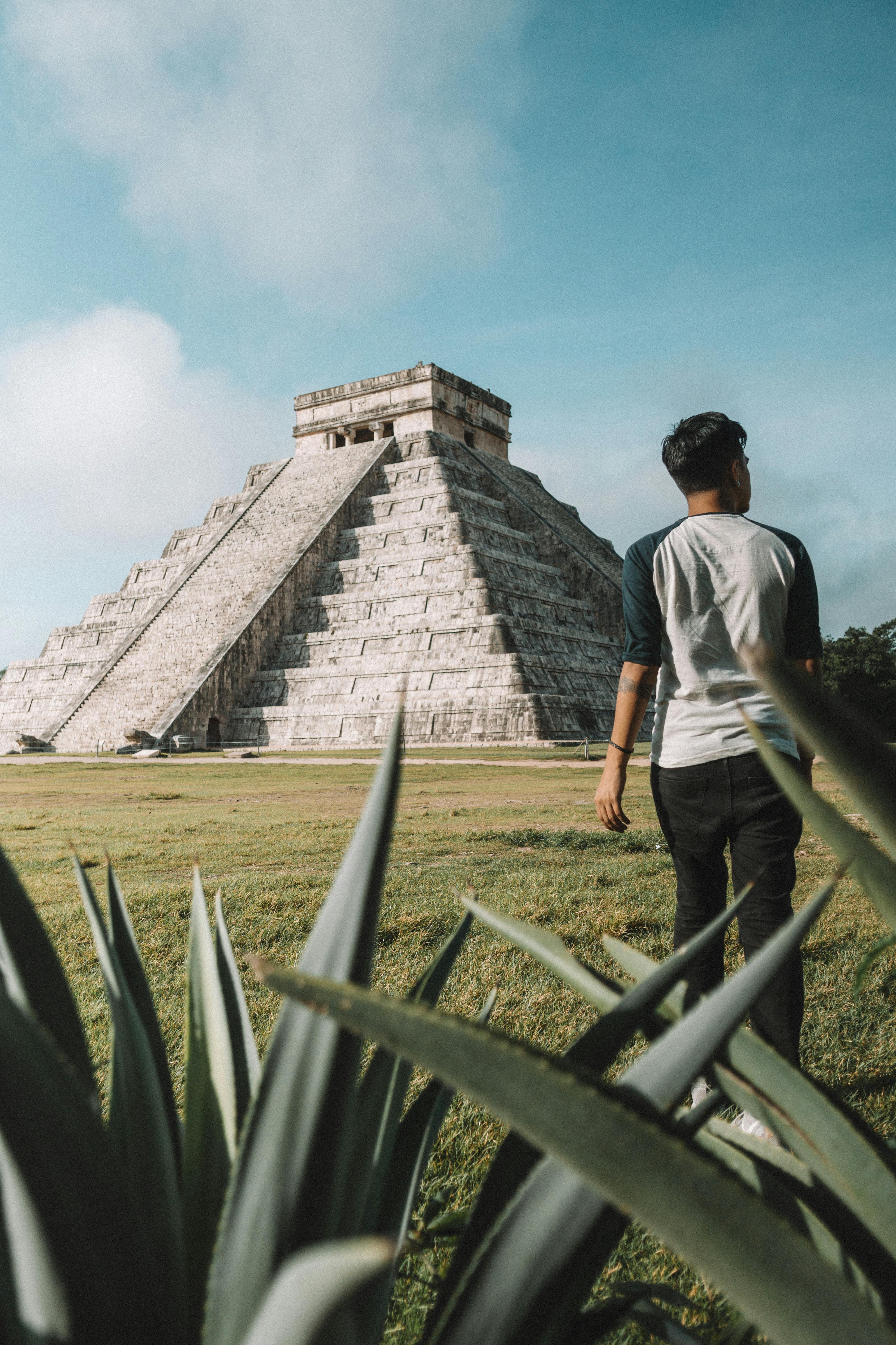 man walking with mayan on background