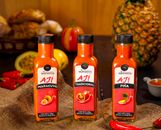 Three varieties of Ecuadorian ají hot sauce with fresh ingredients in Quito setup.