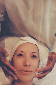 A serene facial treatment session capturing relaxation and skincare focus.