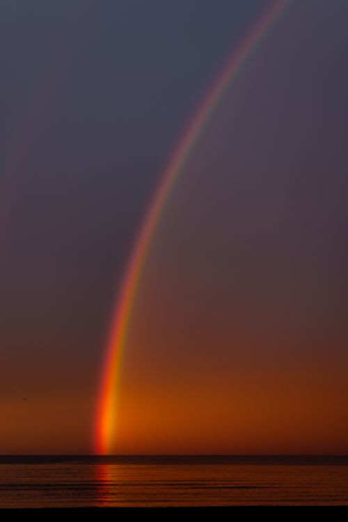 Free Stunning rainbow arcs across ocean at sunset, creating a vivid display of colors over Ünye, Türkiye. Stock Photo