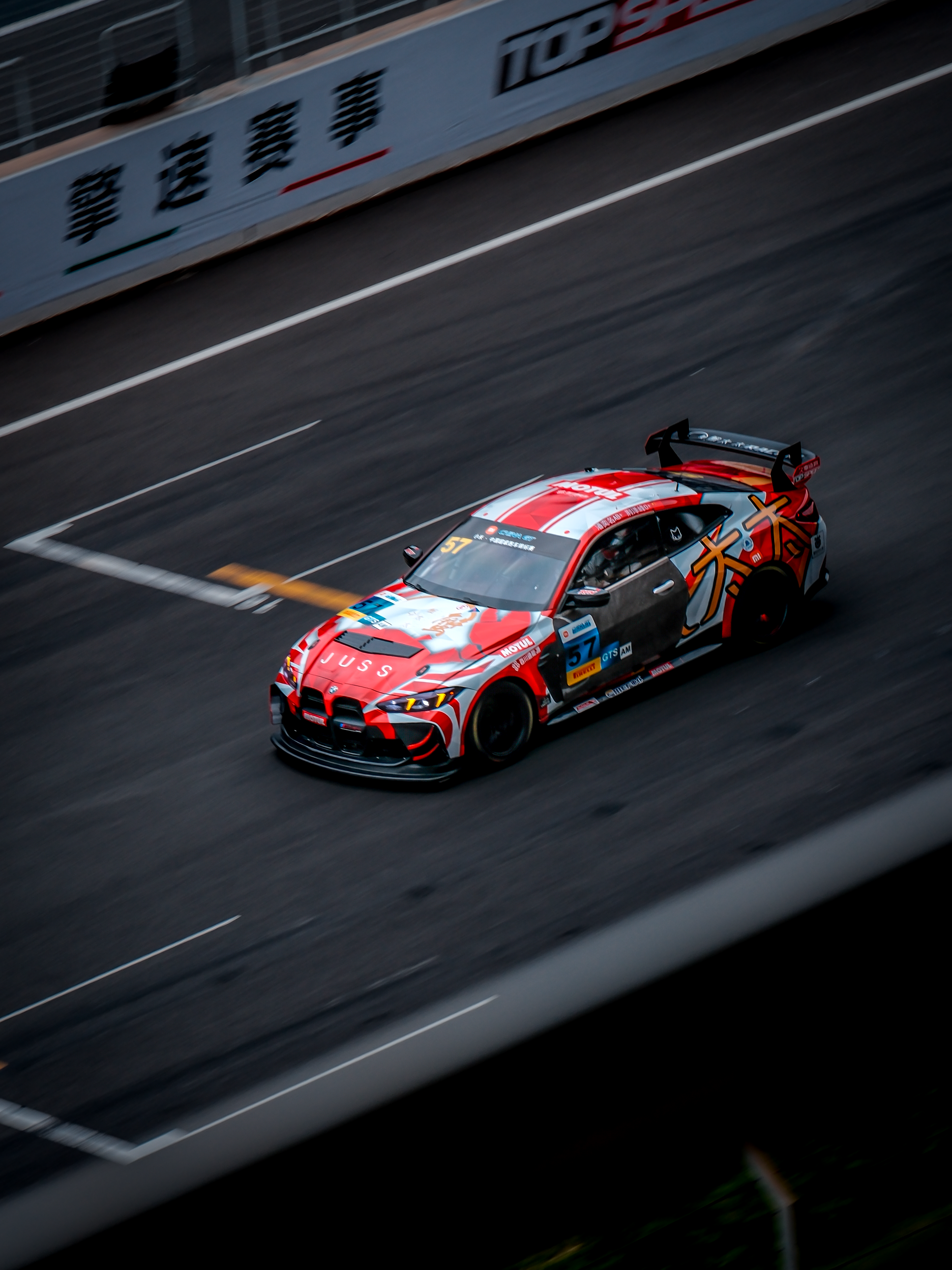 Vibrant Racing Car on Urban Track · Free Stock Photo