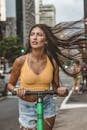 Confident woman riding scooter on street