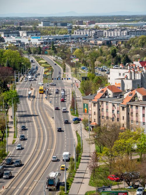 Free Aerial view of Wrocław, Poland showcasing urban roads, greenery, and buildings. Stock Photo