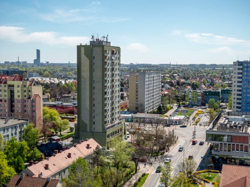 Free Aerial shot of residential buildings in Wrocław, Poland during spring showcasing urban landscape and architecture. Stock Photo