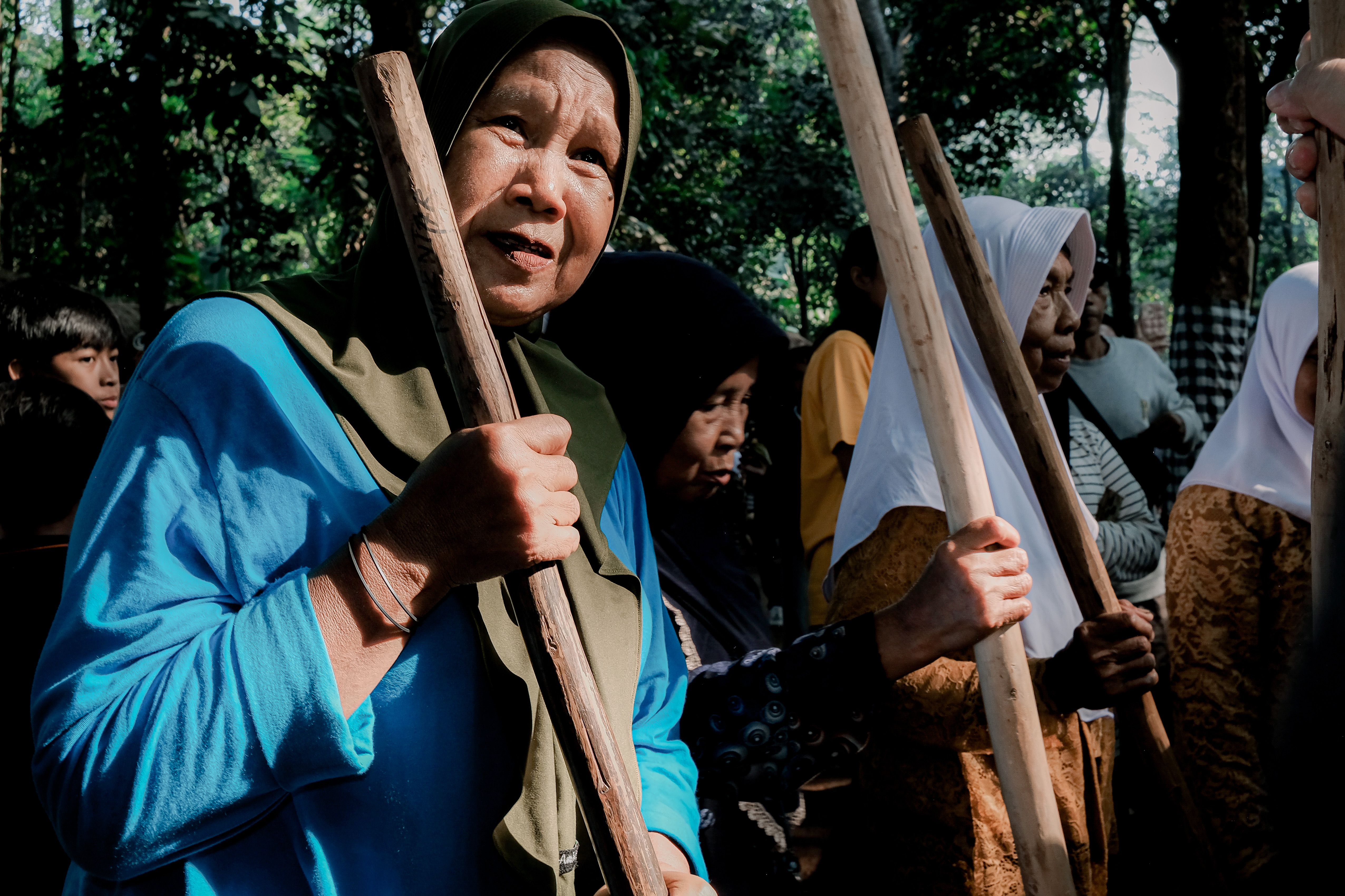 Indonesian women in traditional attire participate in a communal gathering in West Java, Indonesia.