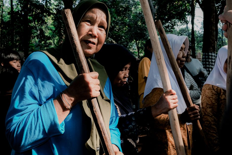 Indonesian women in traditional attire participate in a communal gathering in West Java, Indonesia.
