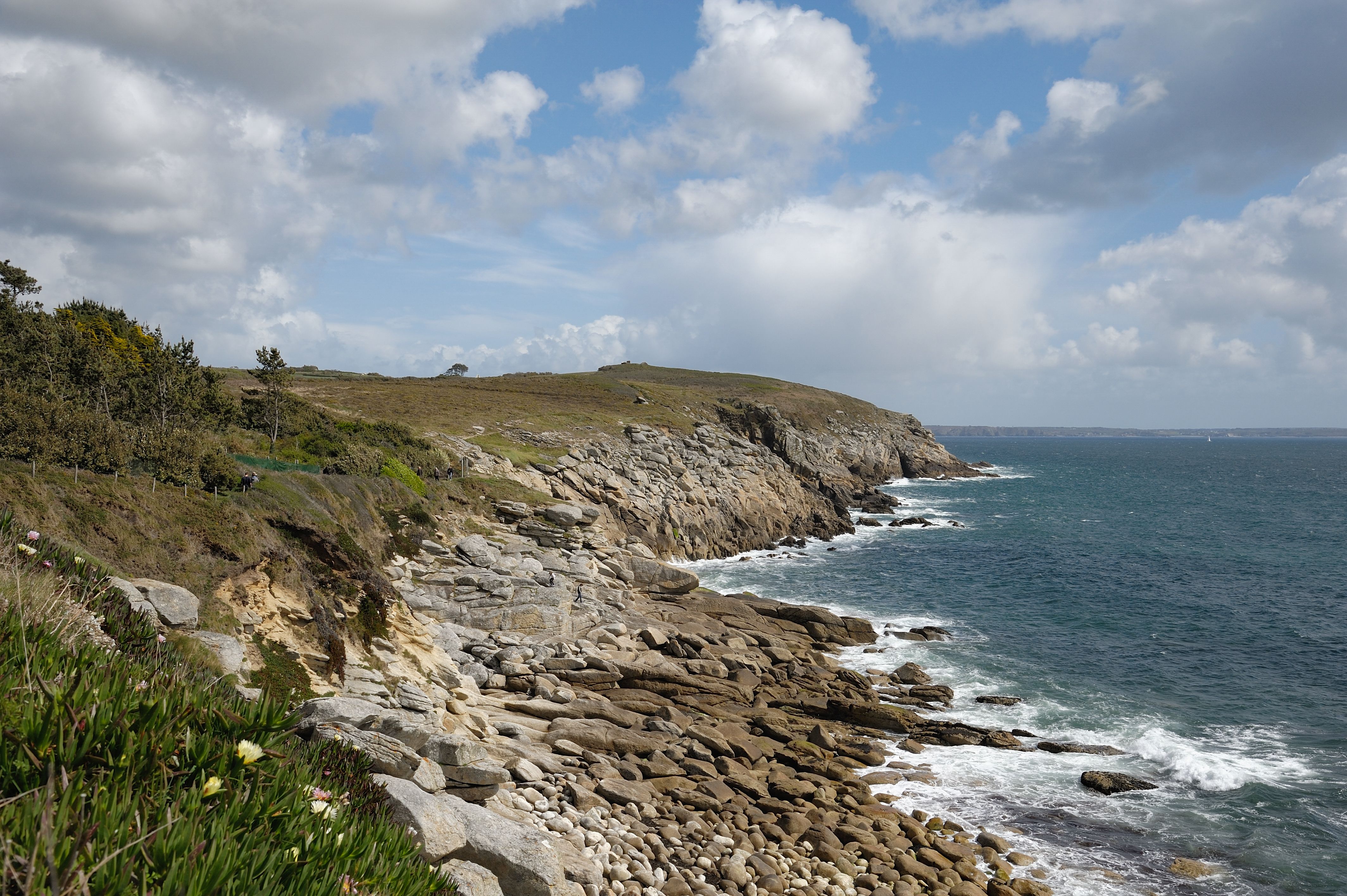 Majestic view of rugged cliffs and ocean waves in Bretagne, France. Perfect coastal scenery.