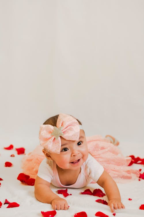 Free Baby in White Floral Head Dress Stock Photo