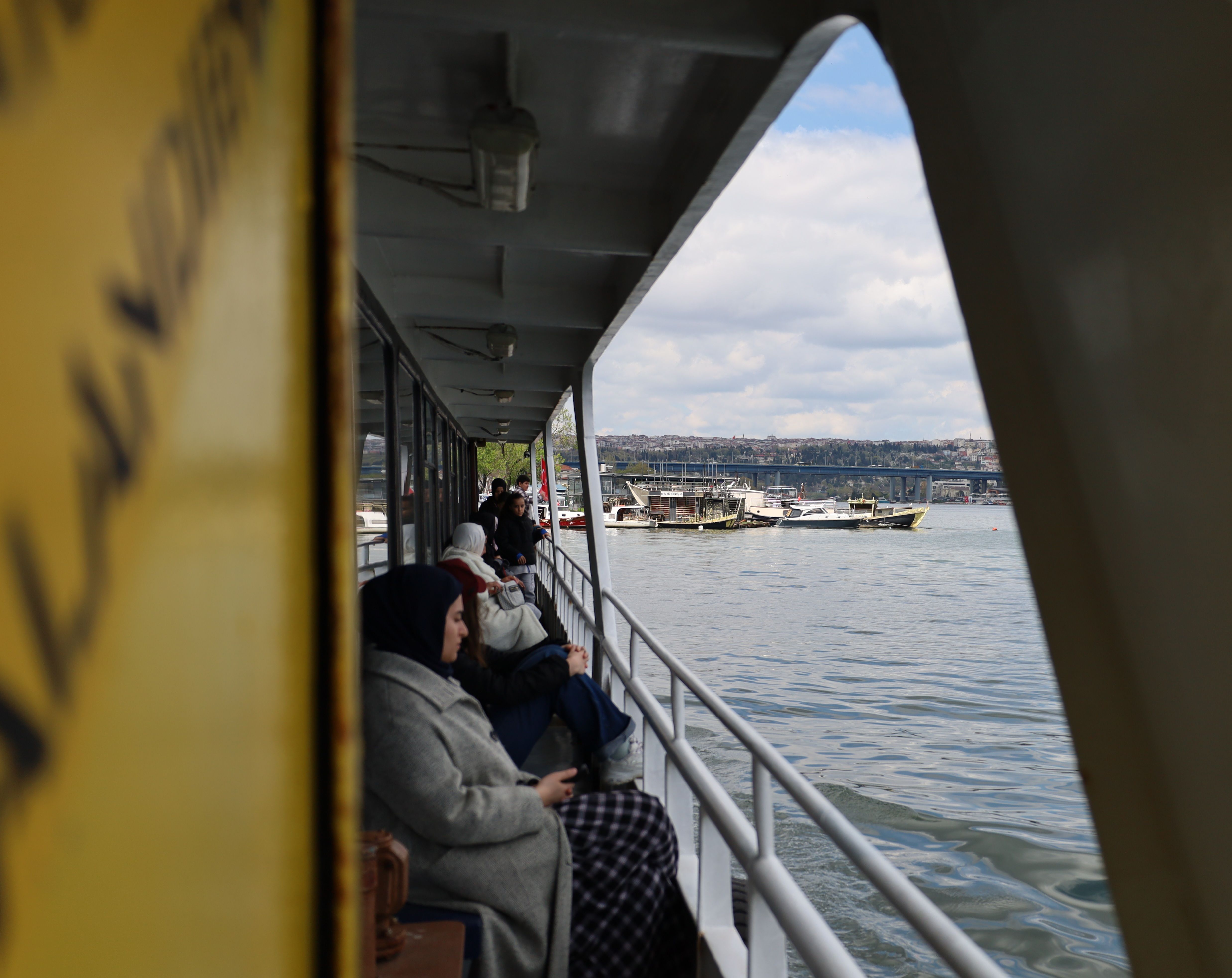 Passengers Relaxing on a Scenic Ferry Ride · Free Stock Photo