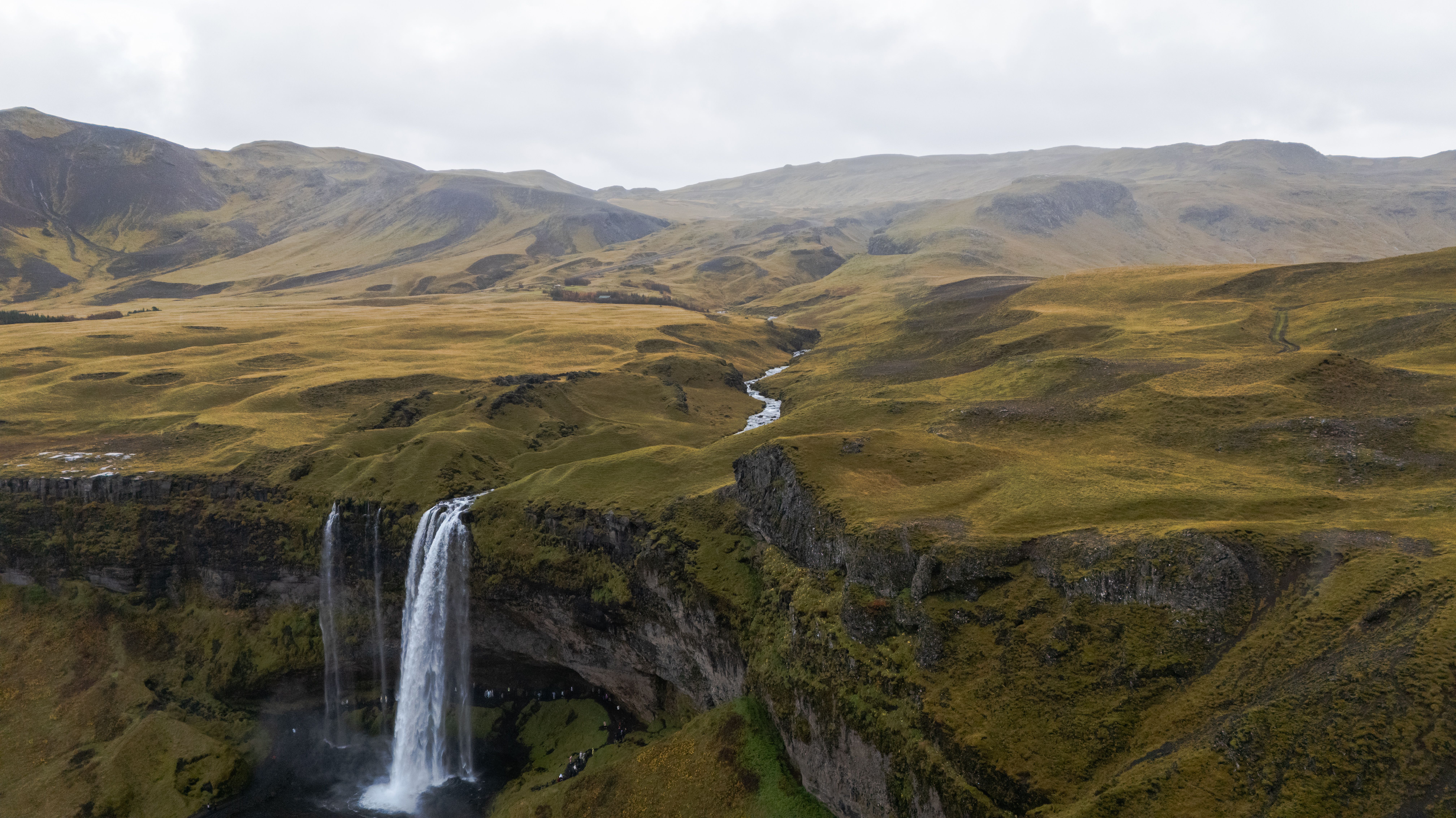 Breathtaking Epic ATV & Helicopter Combo Adventure in Reykjavik Review Review 2026 - A breathtaking aerial view of Seljalandsfoss waterfall in Iceland, surrounded by rugged terrain.