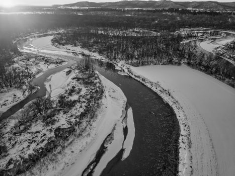 Aerial view of Zumbro River winding through snow-covered landscape in Kellogg, Minnesota.