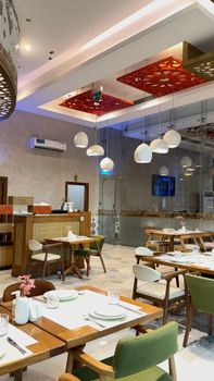 Chic restaurant interior featuring elegant design and contemporary furniture, perfect for dining.