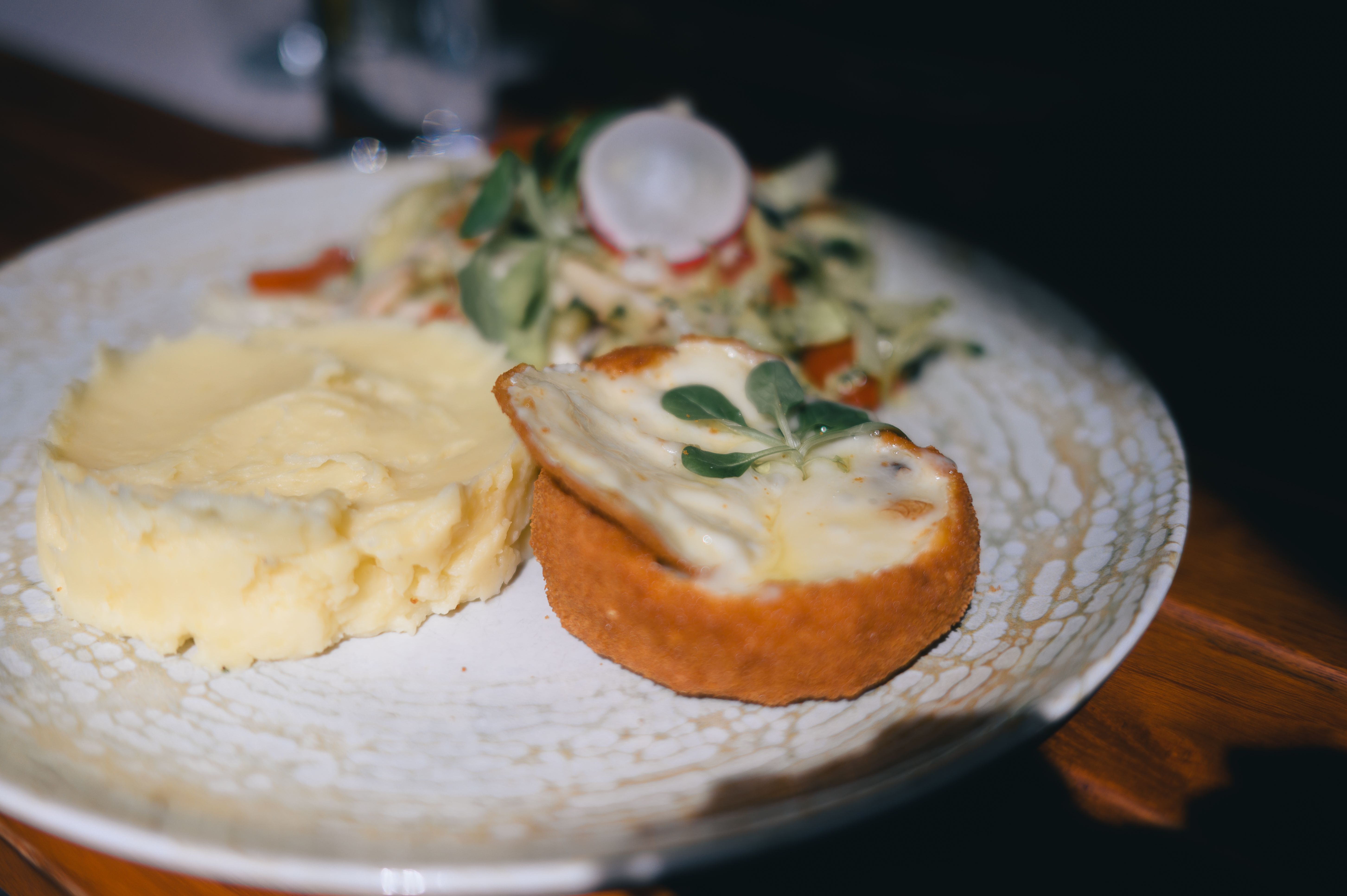 A plate with a traditional Latvian daily lunch special in a cozy Riga restaurant.