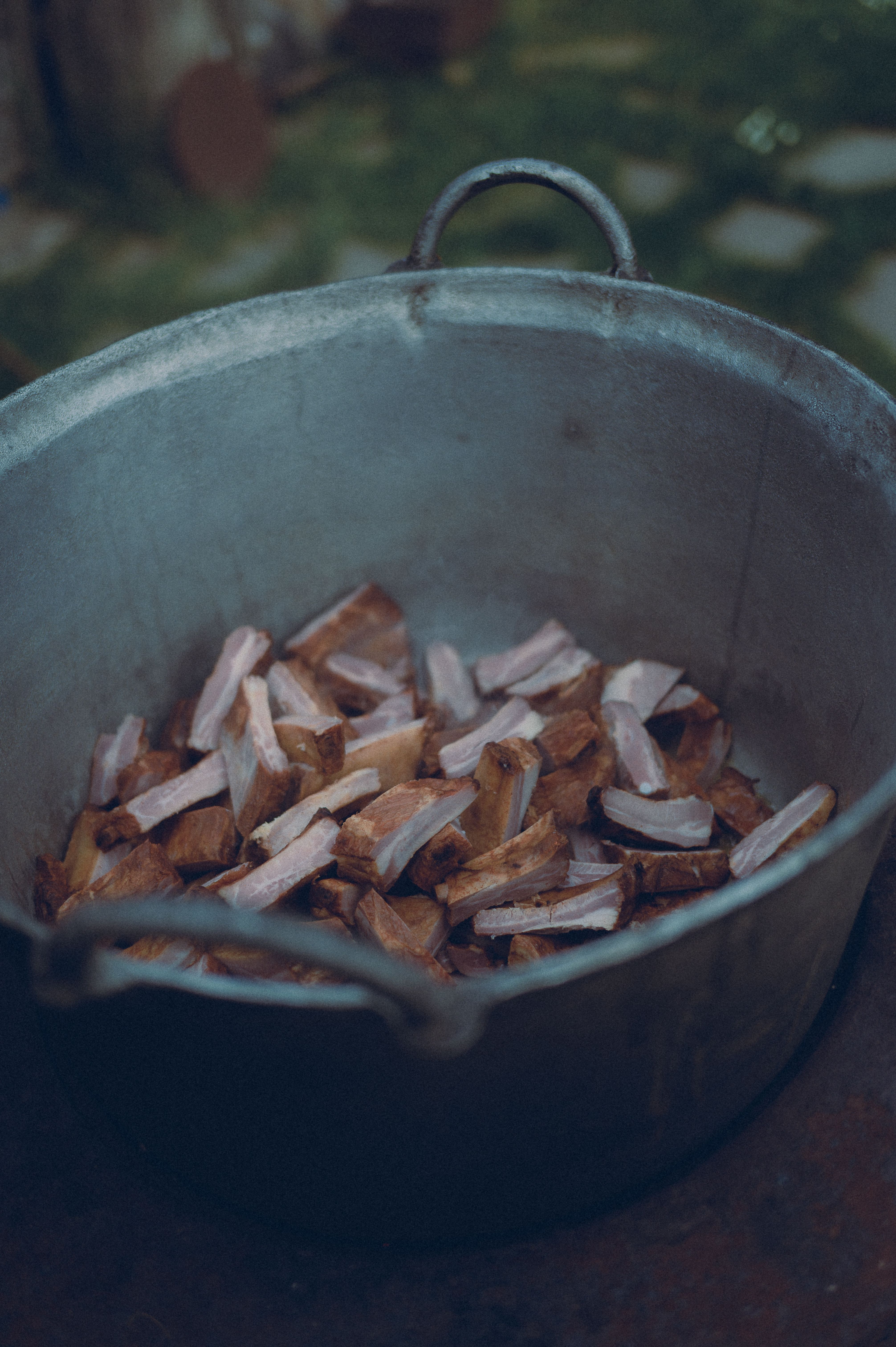 Rustic Cooking Pot Filled with Raw Chopped Wood · Free Stock Photo