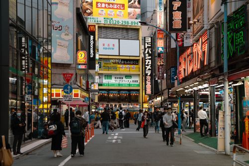 Free Vibrant city life in Tokyo with crowded streets and neon signs. Stock Photo