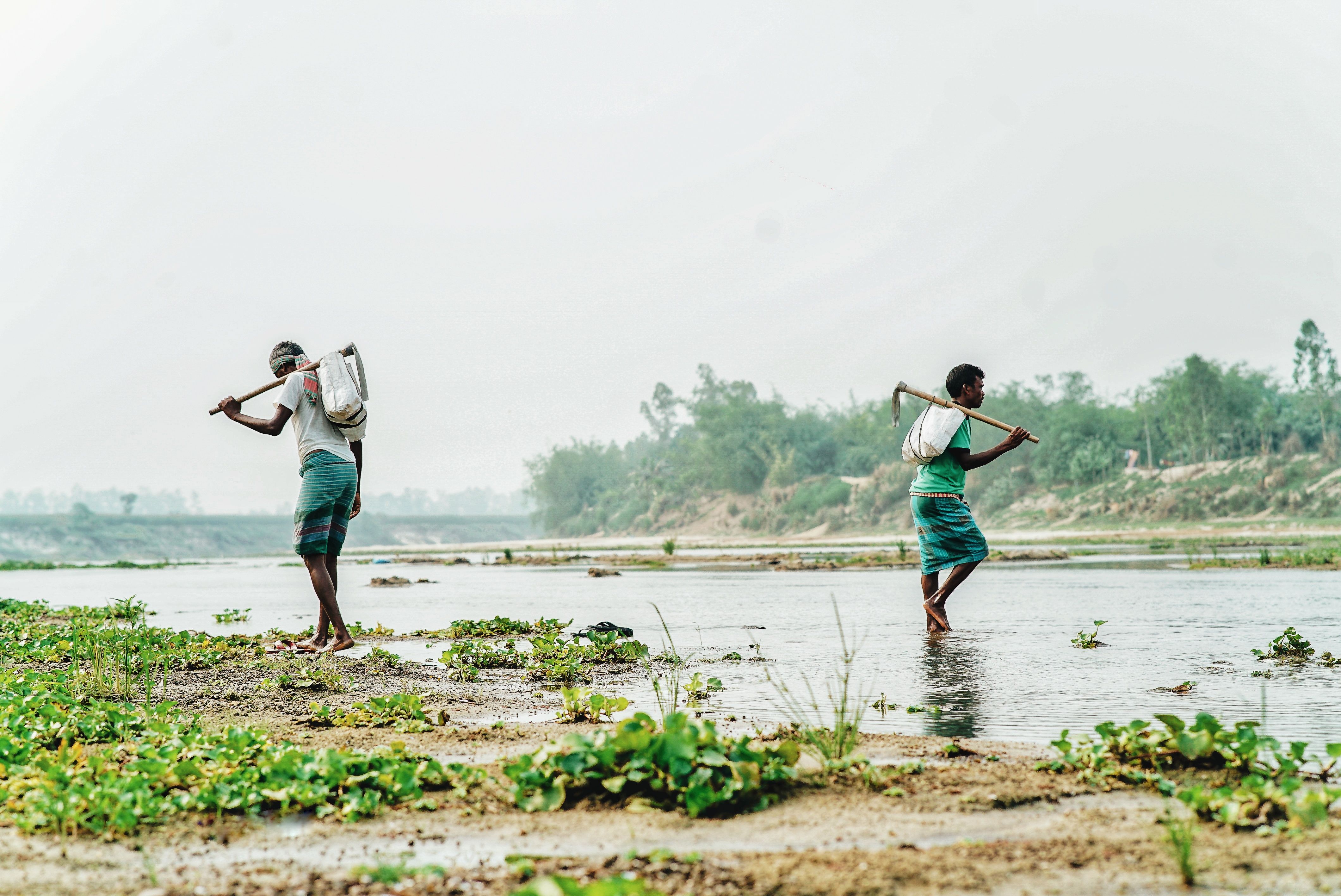 Farmers Crossing River in Rural Landscape · Free Stock Photo