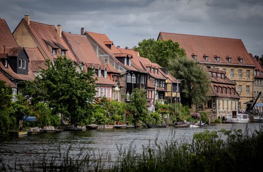 Charming view of Bamberg's Little Venice with traditional houses along the river under overcast skies.