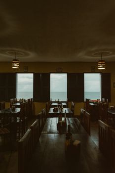 Dimly lit restaurant with ocean view in Natal, Brasil.