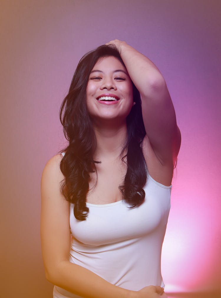 Woman In White Tank Top Smiling