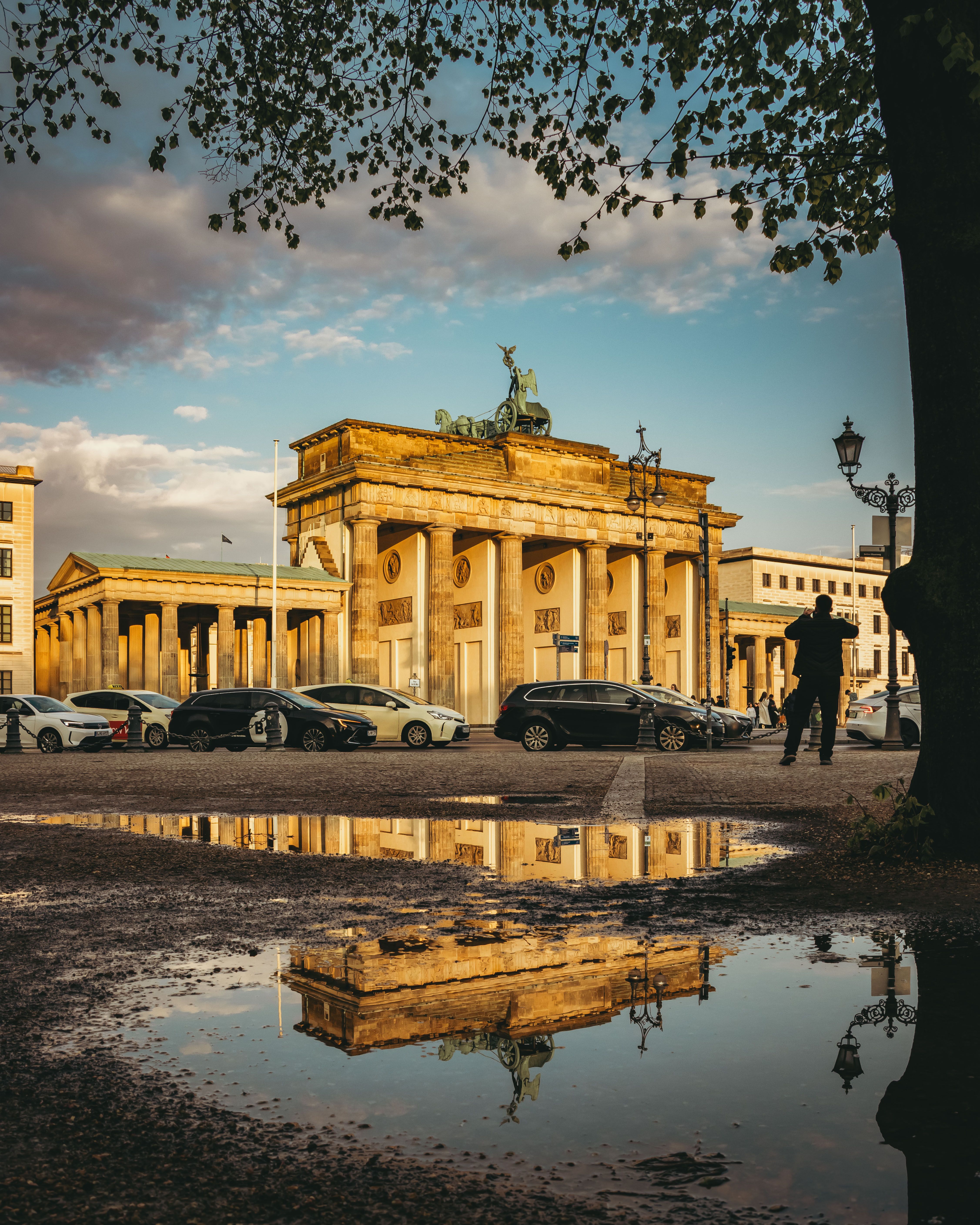 Brandenburg Gate reflected at sunset in Berlin