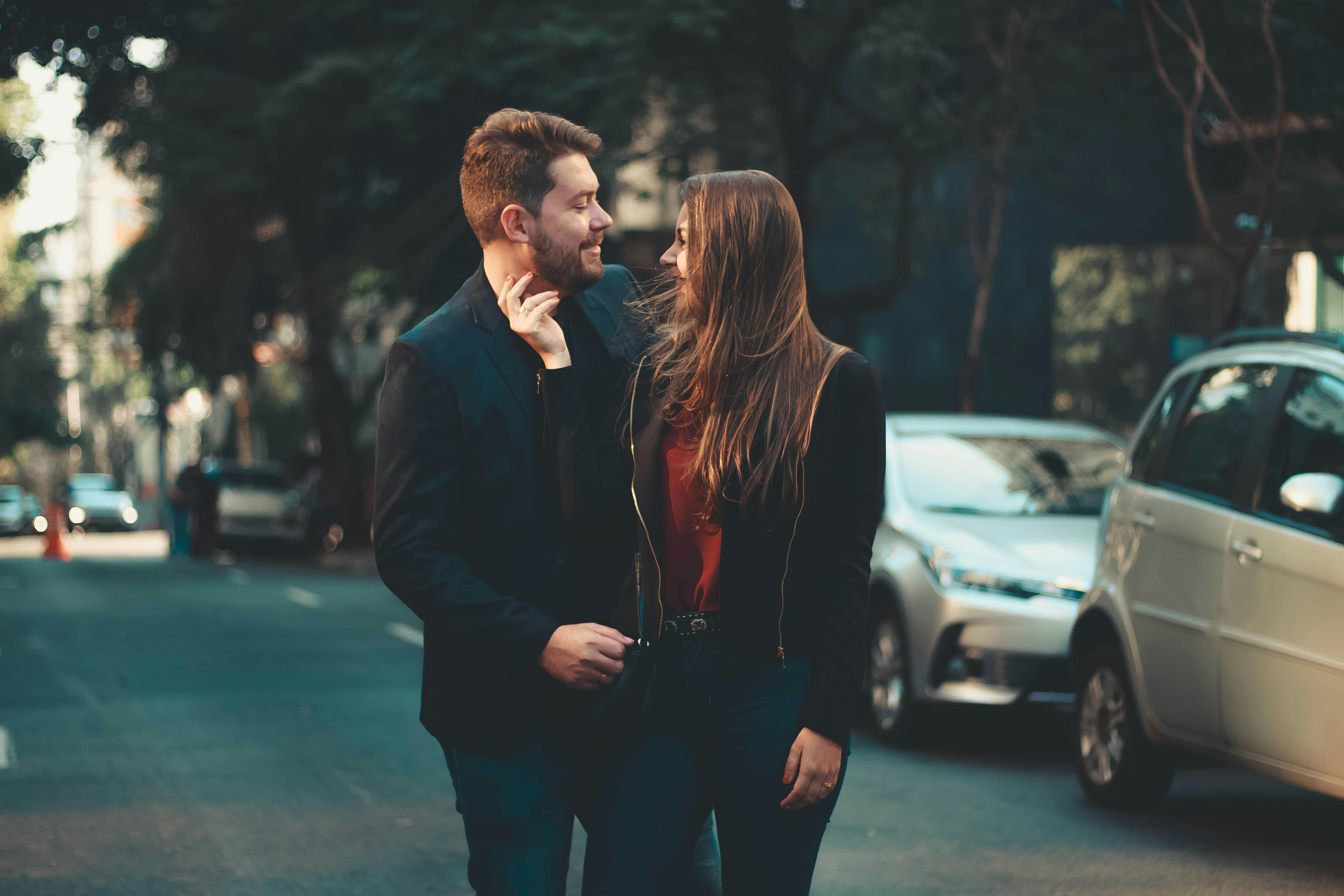 Romantic young couple bonding on street · Free Stock Photo