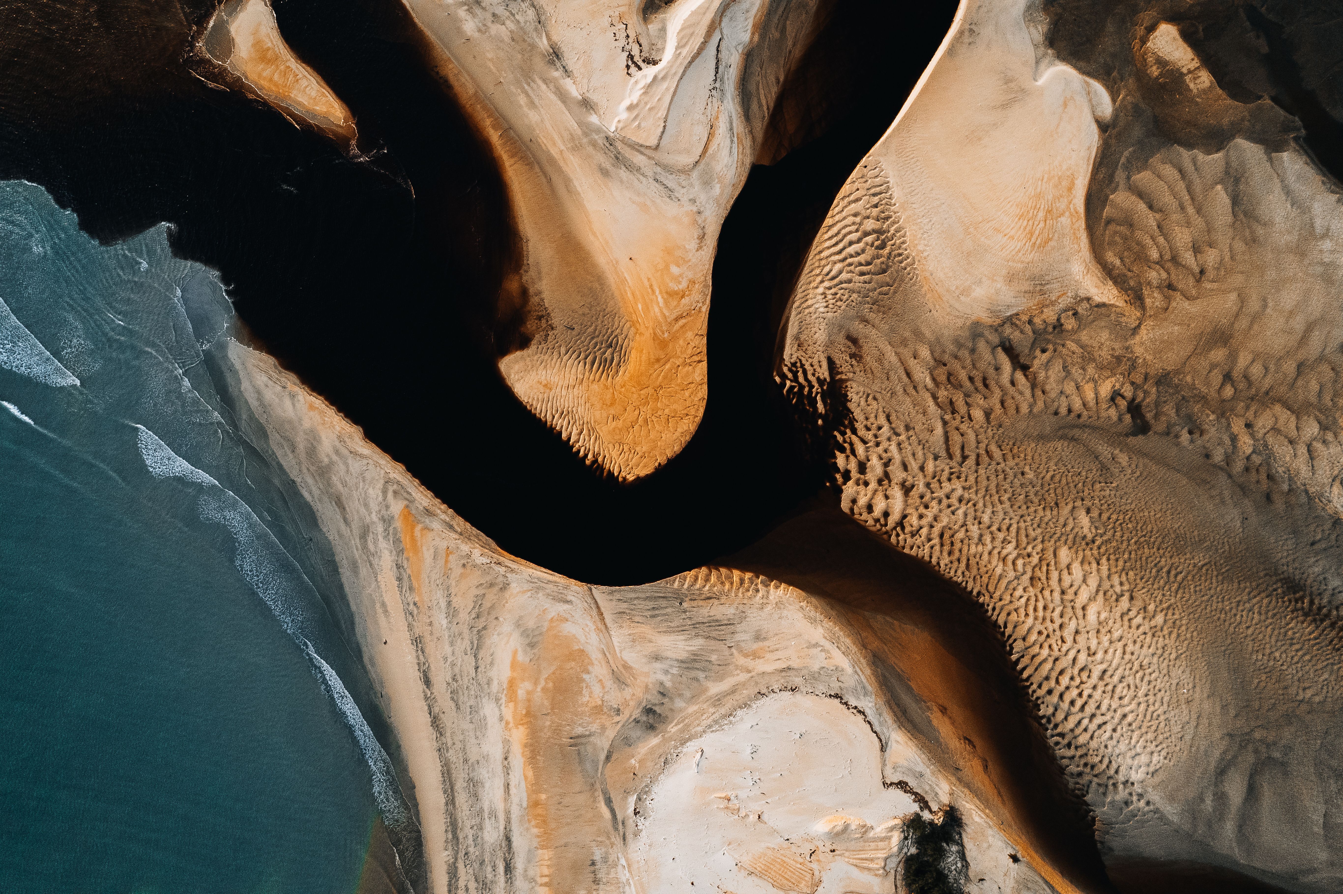 Aerial View of Dramatic Coastal Sand Formations · Free Stock Photo