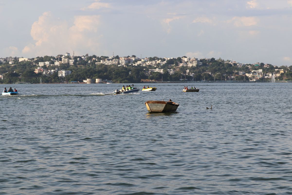 Boats on Upper Lake, Bhopal, with the city skyline in the background
