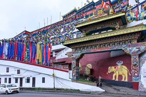 Free Explore the vibrant Tibetan architecture of a monastery in Darjeeling, India, adorned with prayer flags. Stock Photo