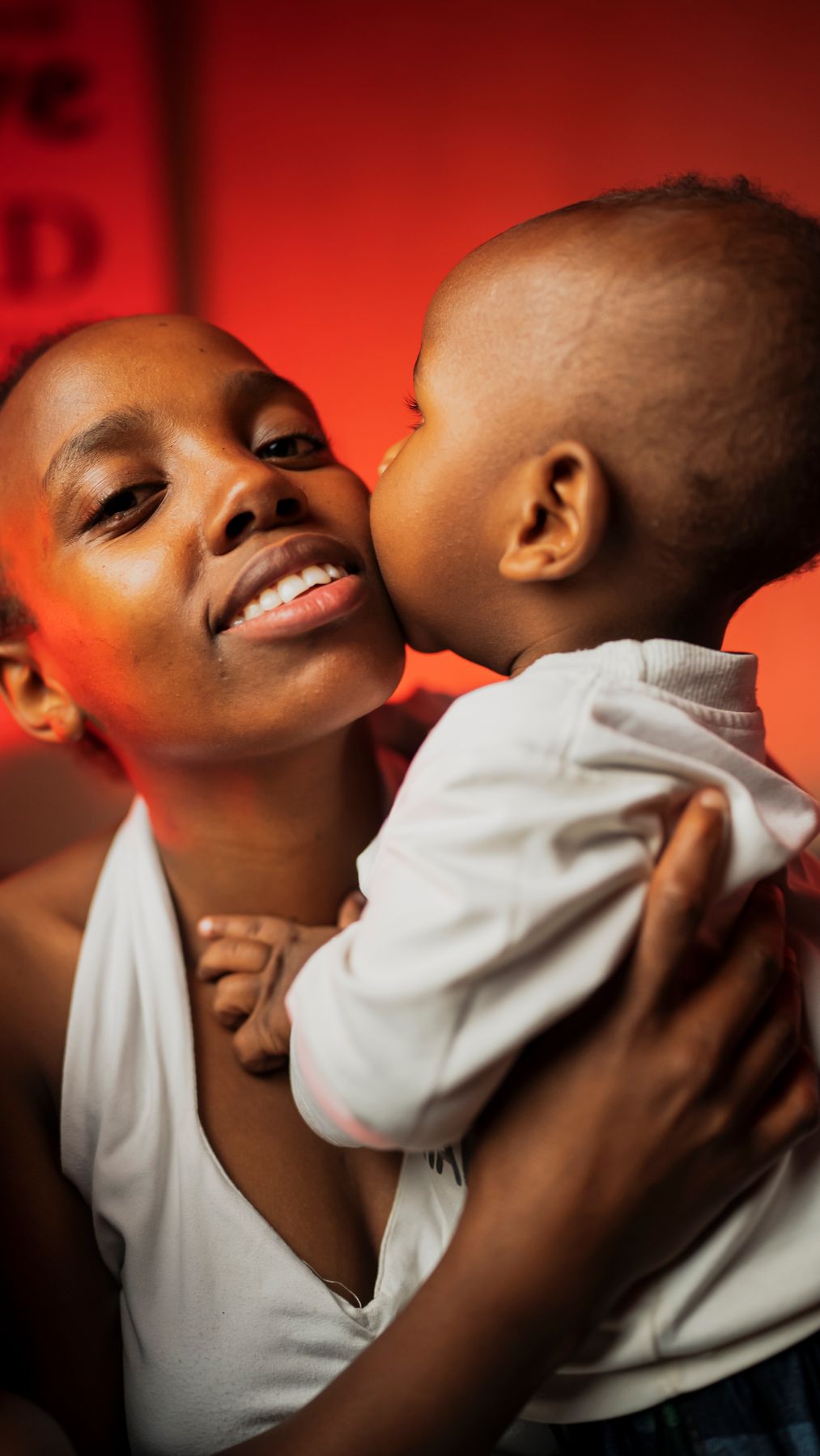 A mother holding her child with warmth and strength